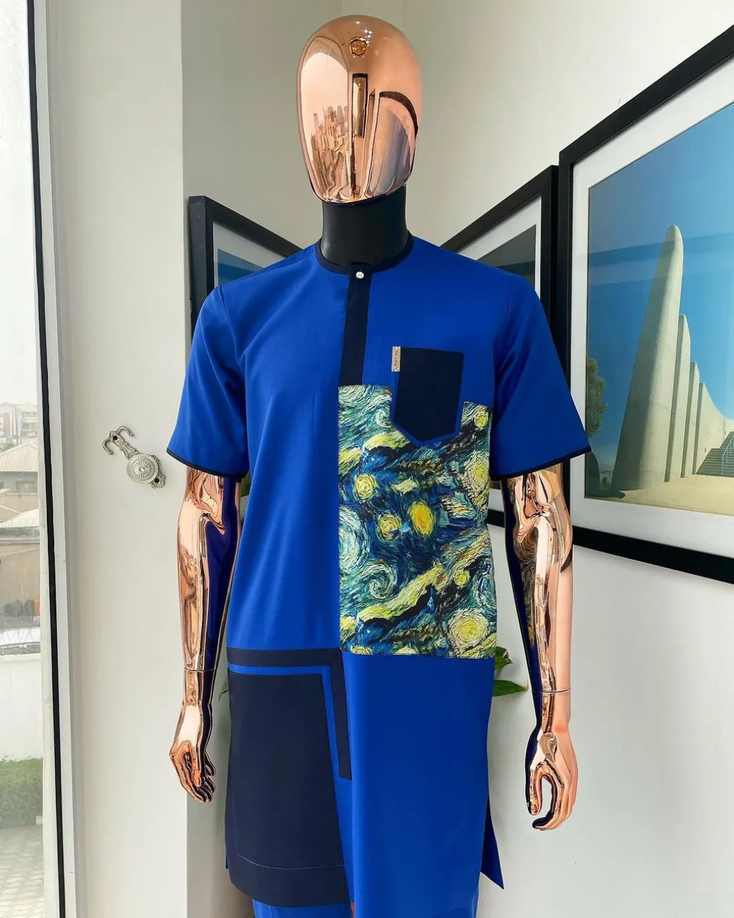 A 3 sector, cloud pattern paisley, royal and navy blue box section, front flap with Swarovski button detailing kaftan native.