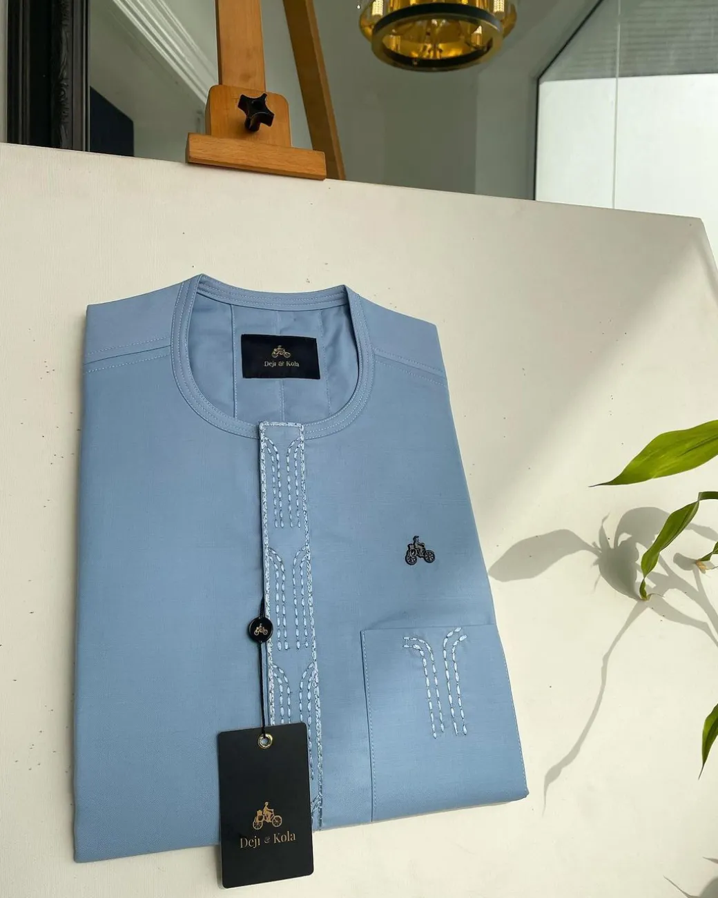 A Baby blue Senator kaftan with bridge and lane dotted front flap & pocket embroidery detailing African traditional native.