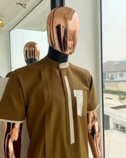 A bishop neck, Peanut and almond cream mix, clear view Swarovski button with layered flap and pocket detailing african traditional senator kaftan native.