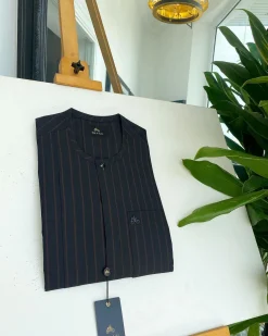 A black and plum bold stripe, black clear view Swarovski buttons, and front flap detail African traditional senator kaftan native