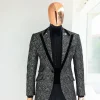 A Black and rust silver pattern jacquard, peak lapel tuxedo suit.