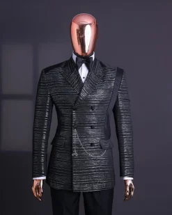 A Black and silver broom metallic scratch pattern jacquard, peak lapel tuxedo, tapered shoulder, double breasted suit