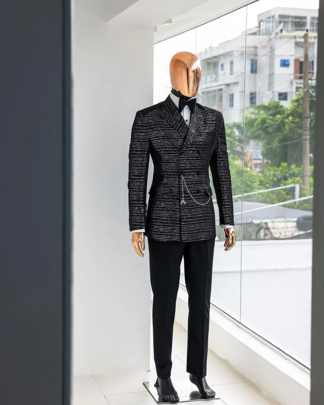 A Black and silver broom metallic scratch pattern jacquard, peak lapel tuxedo, tapered shoulder, double breasted suit