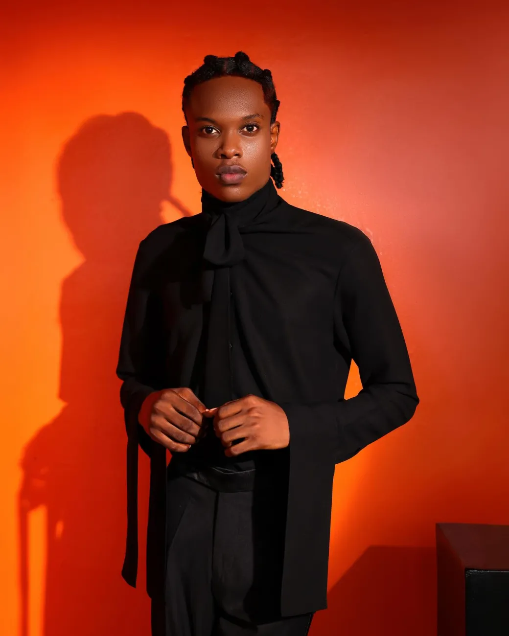 A black, covered neck shirt.
