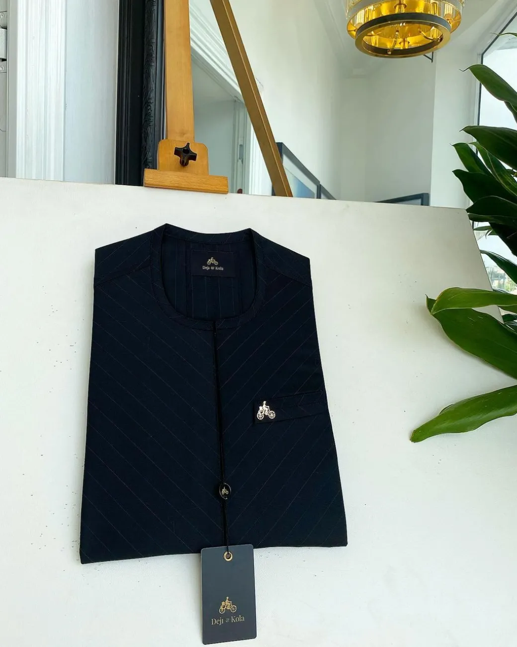 A Black inverted pencil stripe details African traditional senator kaftan native