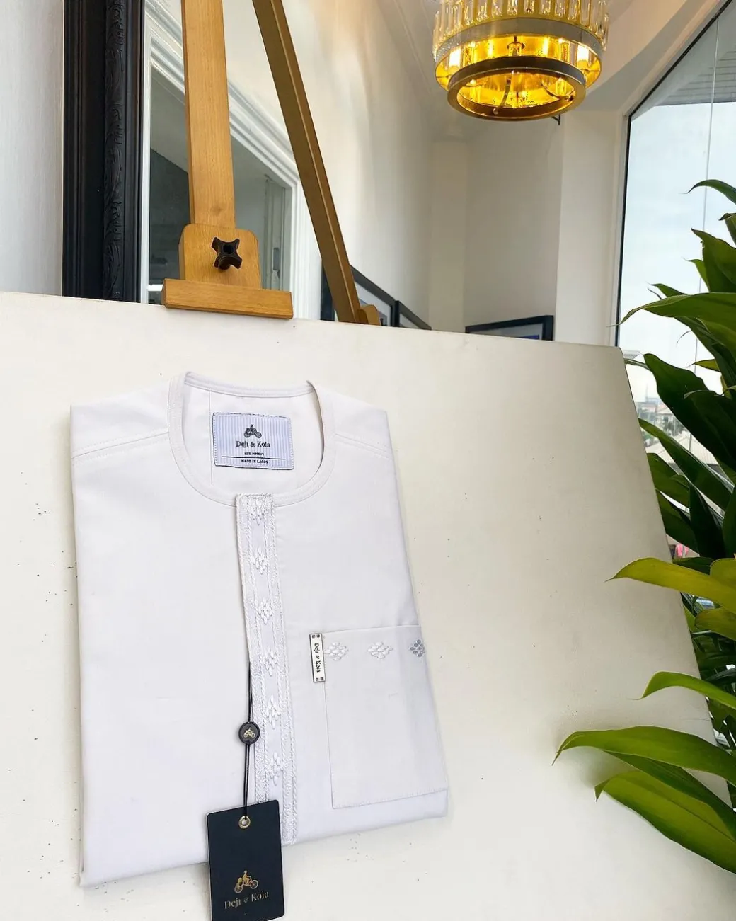 A bold stripe white, patch pocket front flap with embroidery details African traditional senator kaftan native