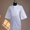 A Bright white, front flap with Swarovski button & metal tag details, 3/4 sleeve African kaftan.