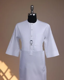 A Bright white, front flap with Swarovski button & metal tag details, 3/4 sleeve African kaftan