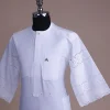 A bright white, Swiss patterned lace, front flap with Swarovski button, 3/4 sleeve African kaftan.