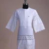 A bright white, Swiss patterned lace, front flap with side pattern, Swarovski button, 3/4 sleeve African kaftan native.