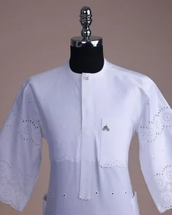 A bright white, Swiss patterned lace, front flap with Swarovski button, 3/4 sleeve African kaftan.