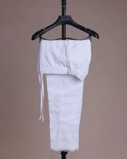 A bright white, Swiss patterned lace, front flap, 3/4 sleeve African kaftan native.