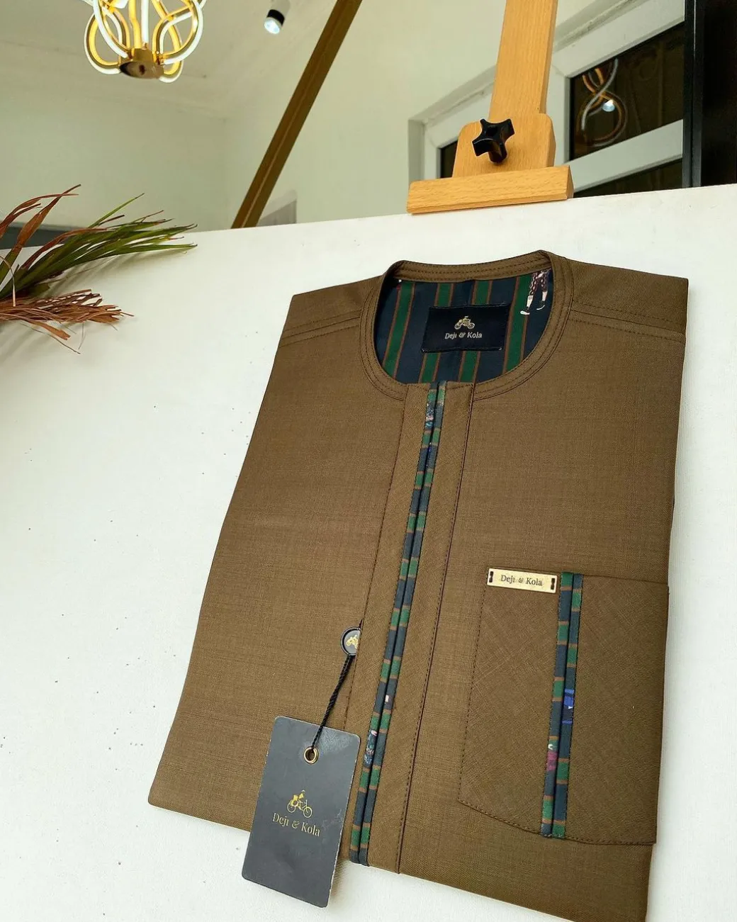 A brown African kaftan with a lining divisional design and Sokoto
