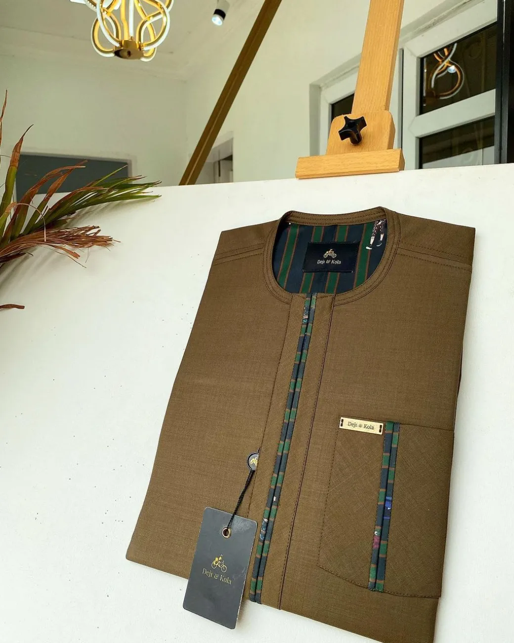 A brown African kaftan with a lining divisional design and Sokoto