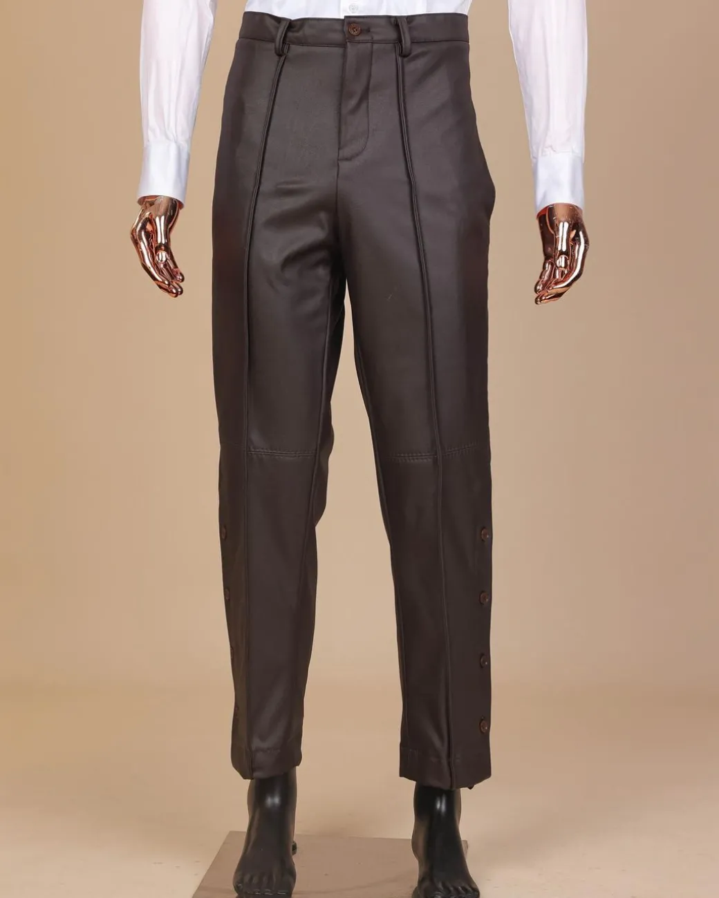 A brown leather, knitted & outer layered pant Trouser with side opening.
