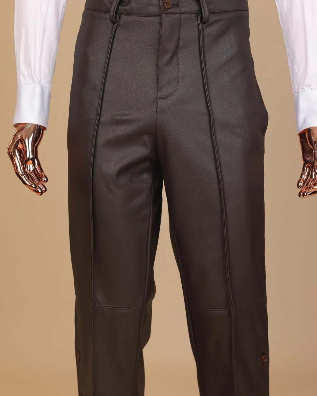 A brown leather, knitted & outer layered pant Trouser with side opening.