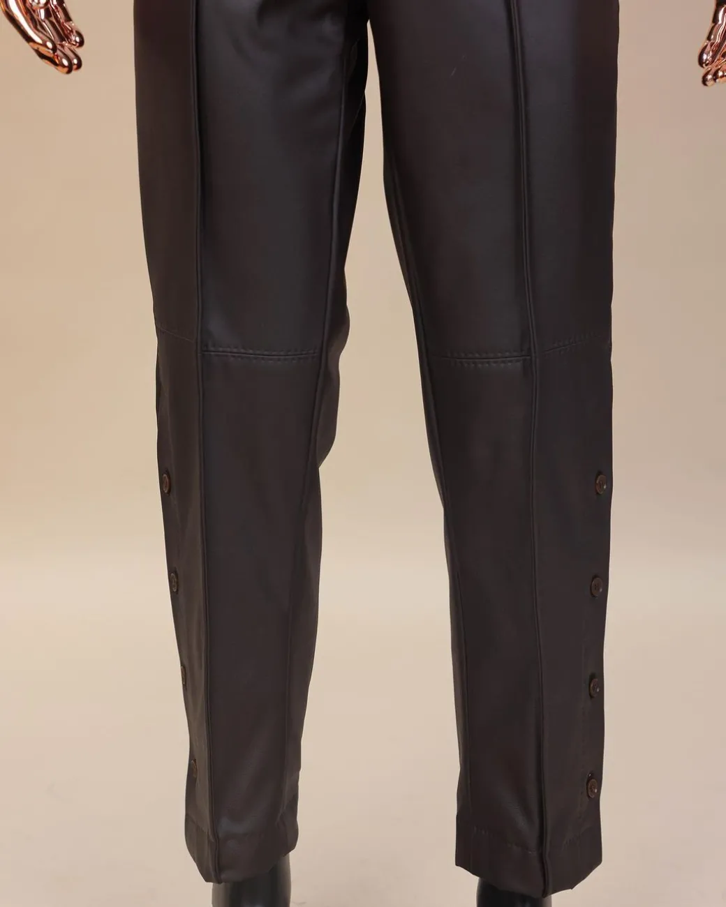 A brown leather, knitted & outer layered pant Trouser with side opening.