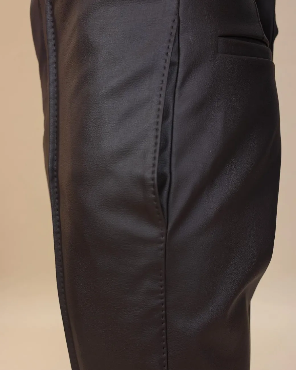A brown leather, knitted & outer layered pant Trouser with side opening.