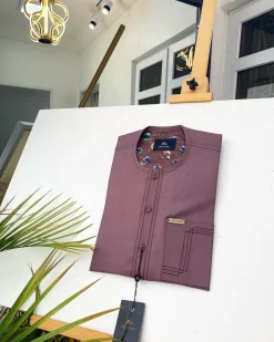 A Brown onion-coloured kaftan with brown coconut shell button detailing, paisley details