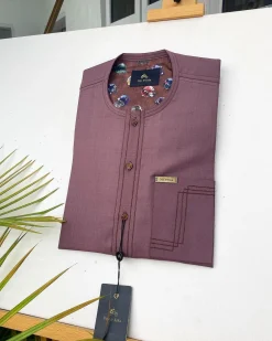 A Brown onion-coloured kaftan with brown coconut shell button detailing, paisley details