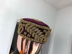 A Burgundy and gold embroidery African traditional hat
