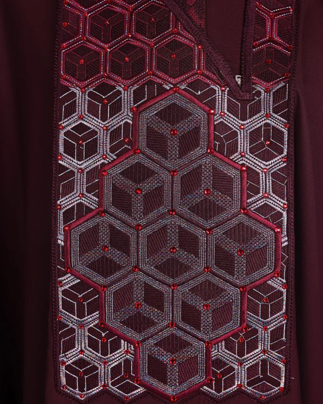 A burgundy, Connected inverted cube -layered 3D embroidery design with splashed burgundy ss30 Swarovski stone details Agbada