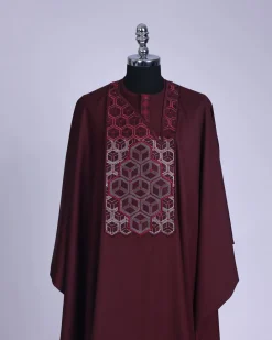 A burgundy, Connected inverted cube -layered 3D embroidery design with splashed burgundy ss30 Swarovski stone details Agbada