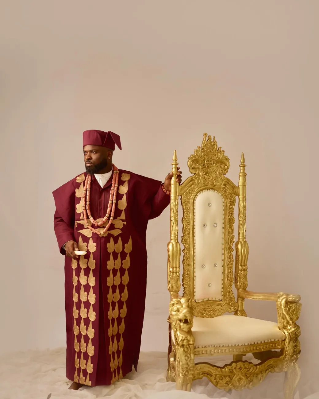 A Burgundy, deltagbada flapper embroidery details agbada