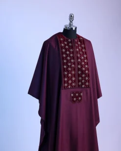 A burgundy, grommet eyelet on dropping octa embroidery details Agbada