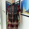 A burgundy Reloaded “isiagu” African traditional Wear with pant trouser