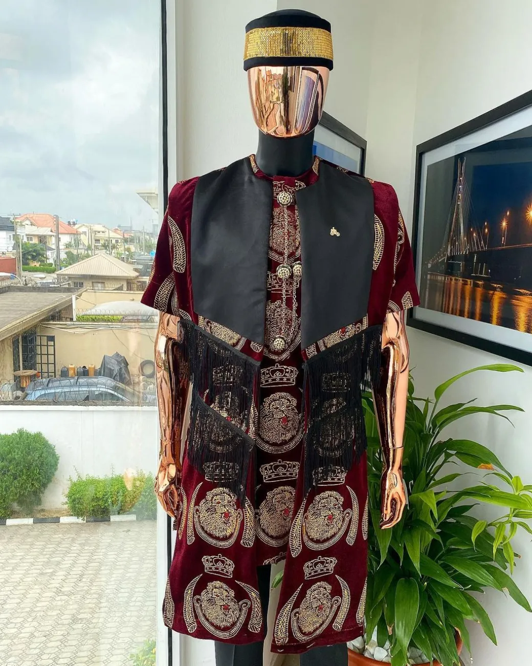 A burgundy Reloaded “isiagu” African traditional Wear with pant trouser