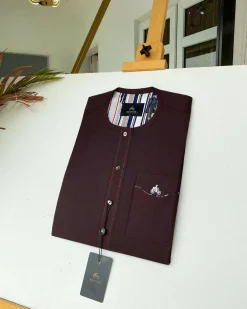 A burgundy with Swarovski button details African kaftan