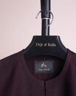 A burgundy, zipline with lower embroidery details, short sleeve African senator kaftan native.