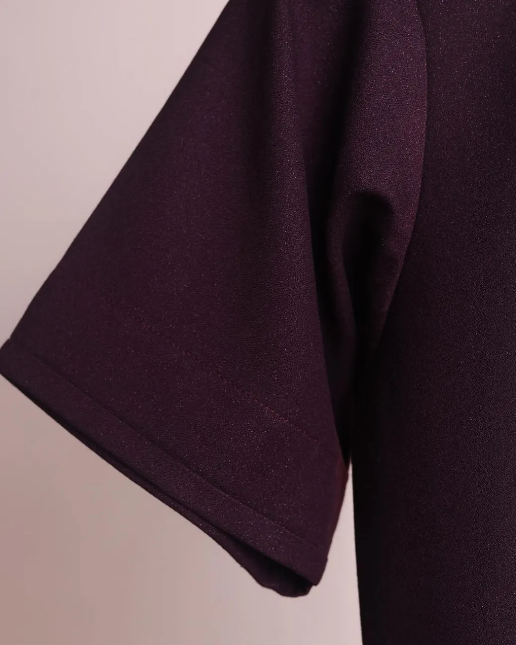 A burgundy, zipline with lower embroidery details, short sleeve African senator kaftan native.