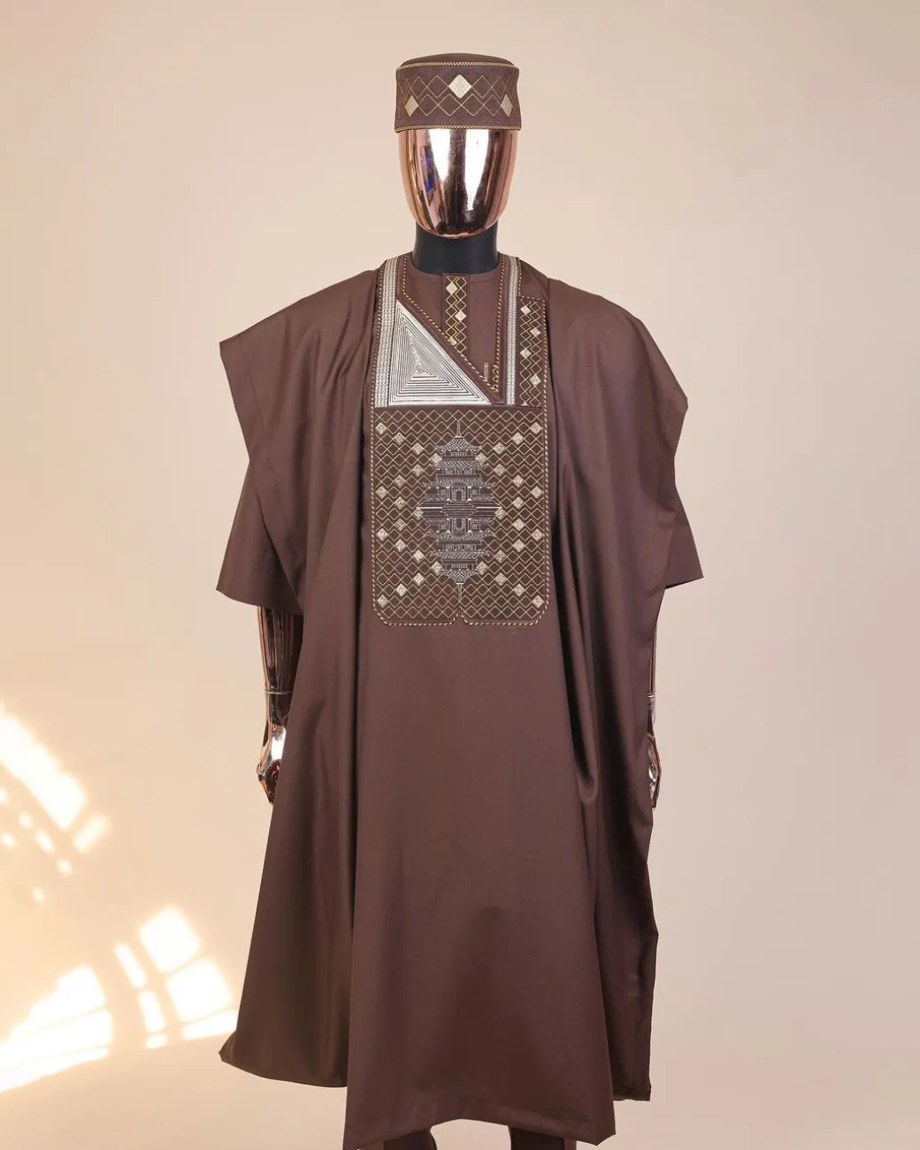 A Caramel Brown, chinoiserie chic pagoda with layers metallic wire embroidery details agbada