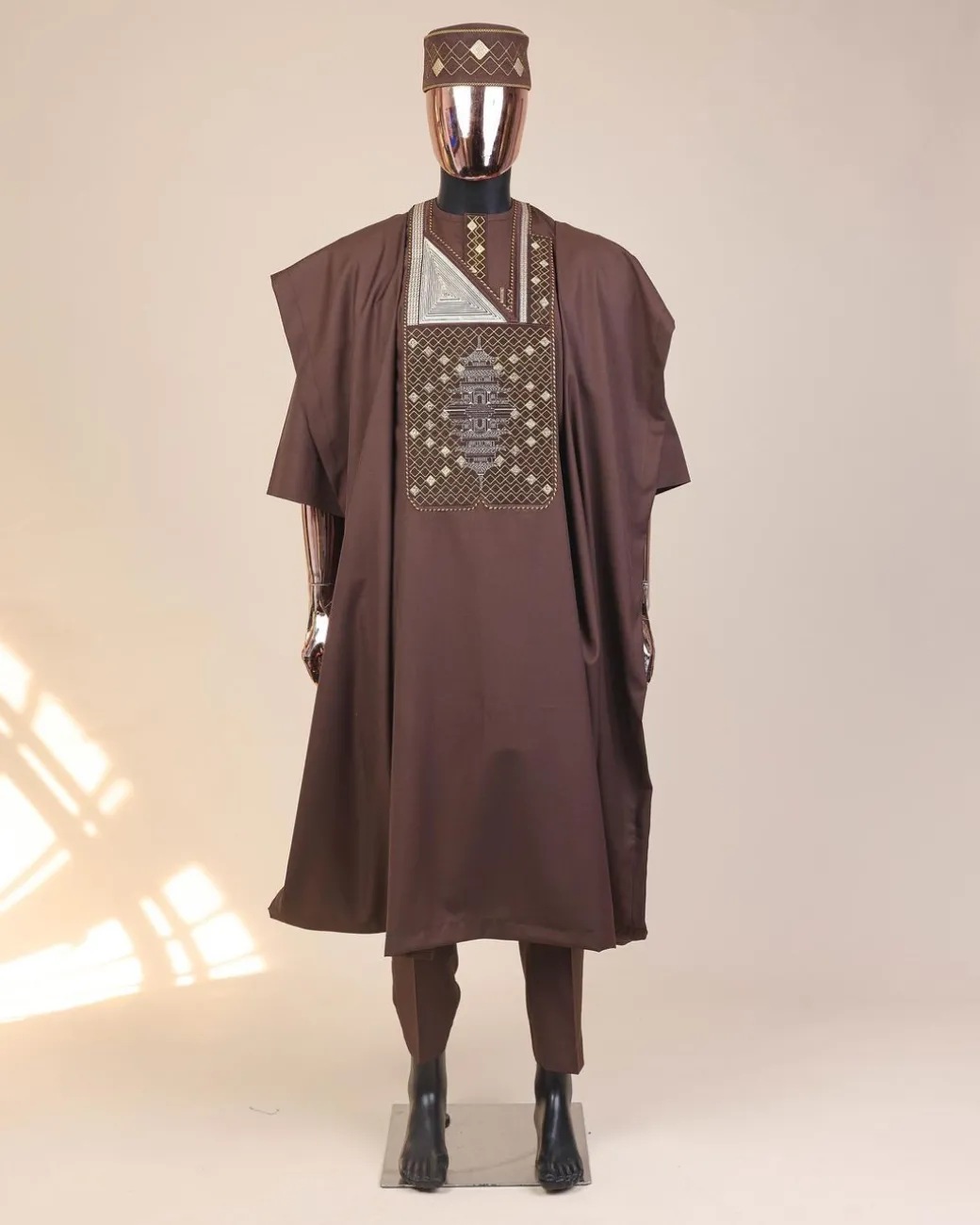 A Caramel Brown, chinoiserie chic pagoda with layers metallic wire embroidery details agbada