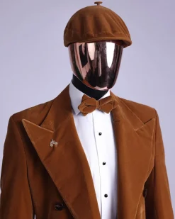 A Caramel brown, soaked velvet, peak lapel double breasted trench suit
