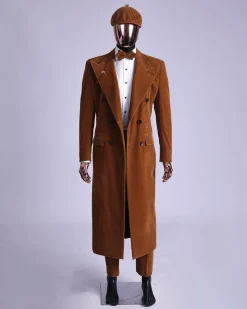 A Caramel brown, soaked velvet, peak lapel double breasted trench suit