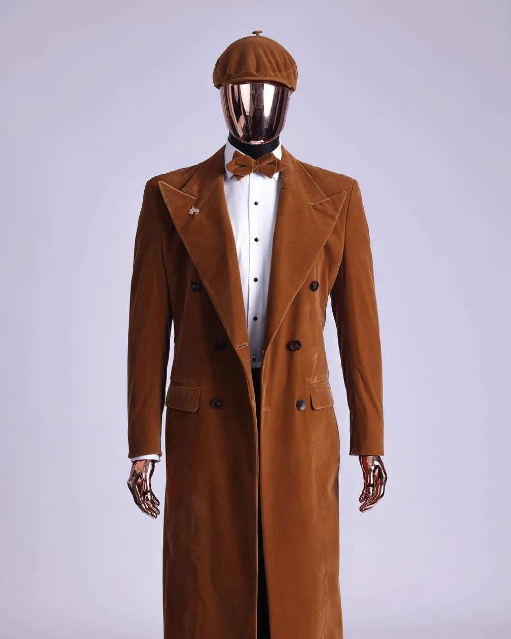 A Caramel brown, soaked velvet, peak lapel double breasted trench suit