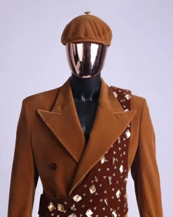 A Caramel brown, soaked velvet, peak lapel double breasted trench suit