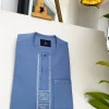 A Carolina blue, embroidery front flap, clear view Swarovski button, African traditional senator kaftan native.