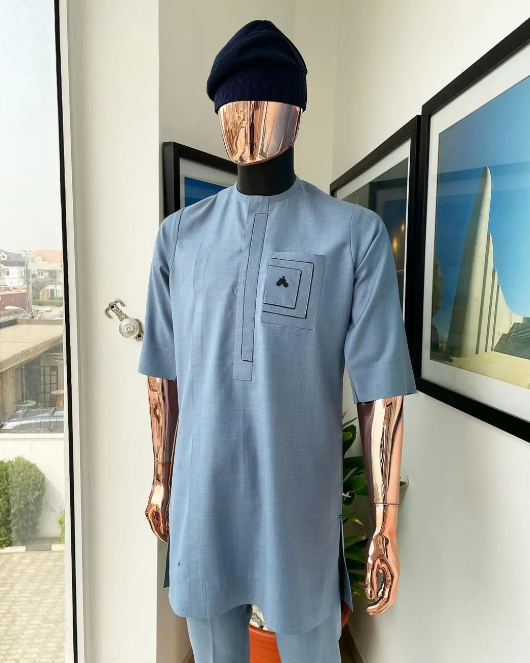 A Carolina blue, layered rectangle and square embroidery flap and pocket detailing african traditional senator kaftan native.