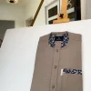 A Carton brown African kaftan with paisley details, Swarovski buttons and sokoto