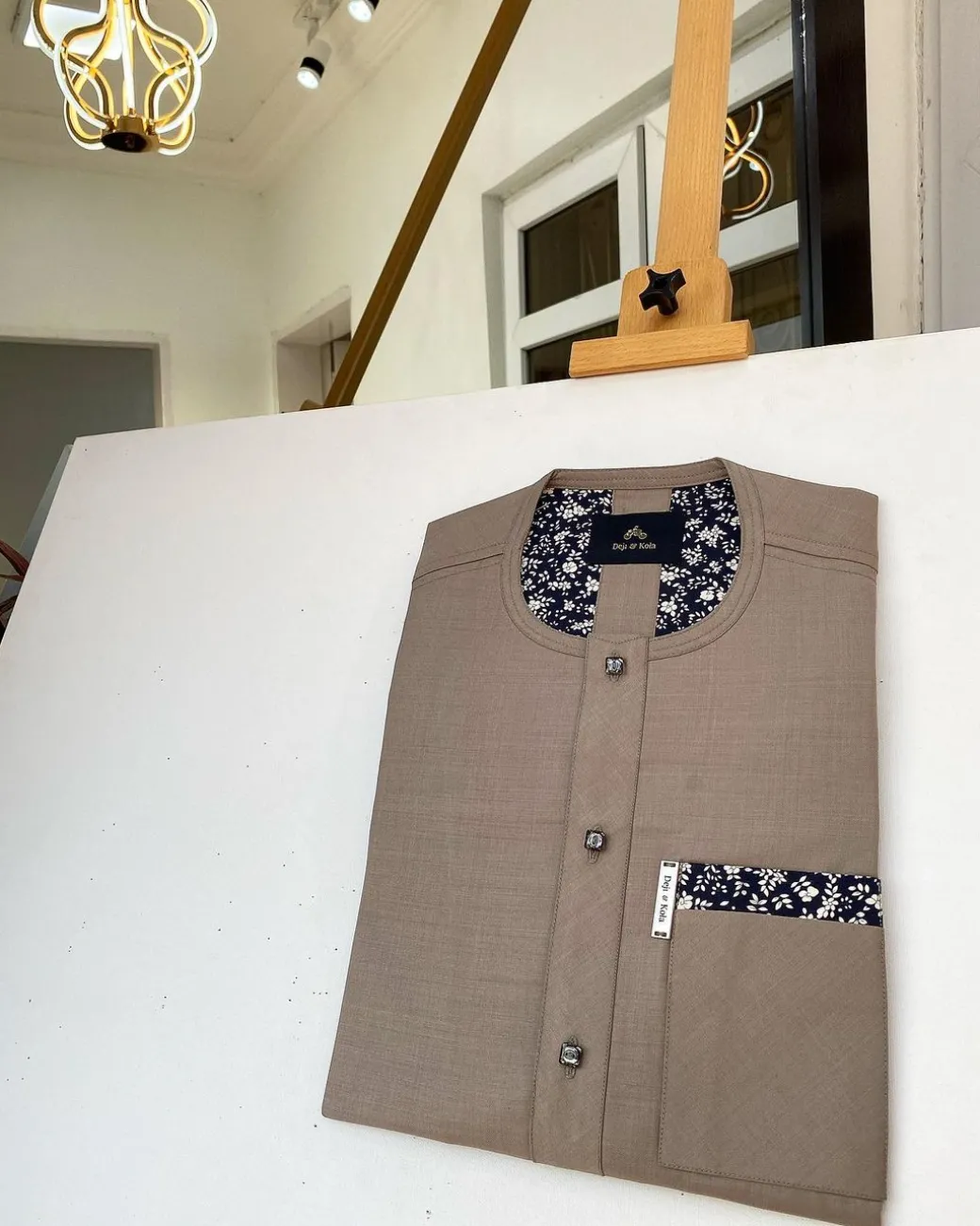 A Carton brown African kaftan with paisley details, Swarovski buttons and sokoto
