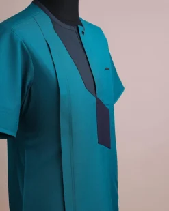 A Castleton green, front flap, patterned flap with black Swarovski button, short sleeve African senator kaftan native.
