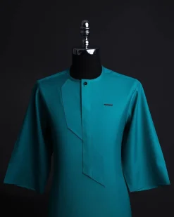 A Castleton green, front flap, patterned flap with black Swarovski button, short sleeve African senator kaftan native.