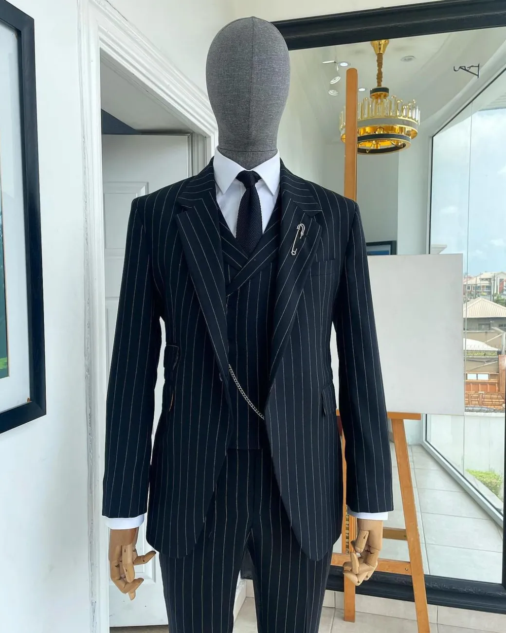 A charcoal black & white pencil stripe Jorgecarli ceremonial super 140’s “Board Room” notch lapel patch pocket suit