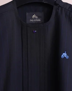 A charcoal black and admiral blue pencil stripe, invisible neckline zip line with layered front flap details, short sleeve African senator kaftan native.