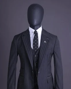 A charcoal black and ivory pencil stripe, notch lapel, knitted one button suit