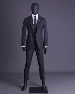 A charcoal black and ivory pencil stripe, notch lapel, knitted one button suit